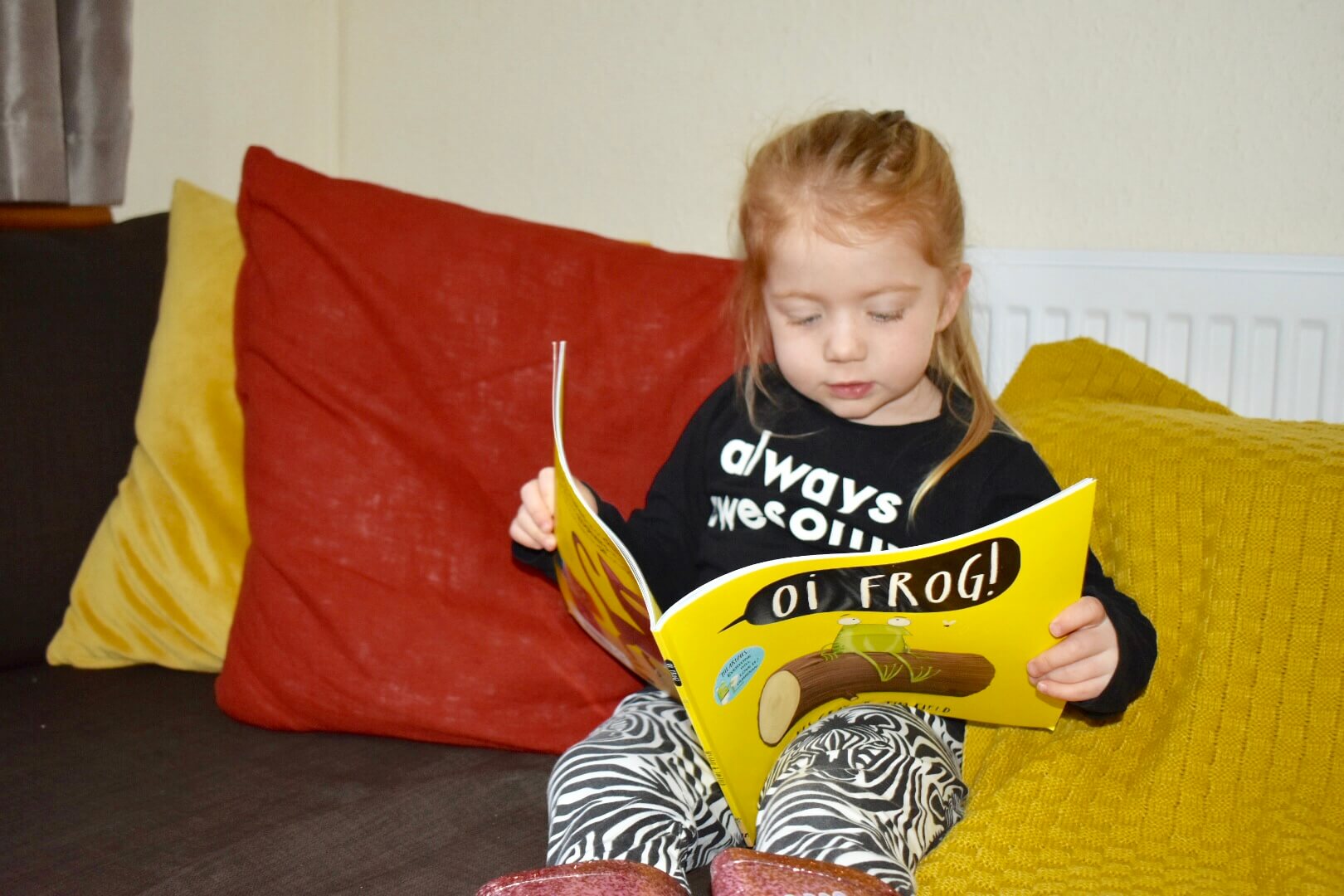 Little girl reading book